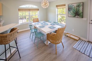 Beautiful dining area with loads of natural sunlight coming through the windows