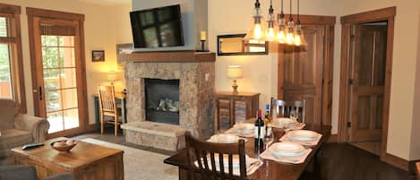 Living room with stone fireplace and 50" HDTV.