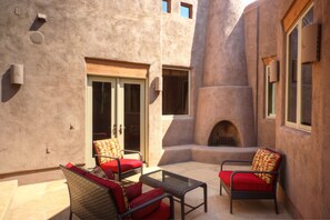 Outdoor fireplace area in backyard