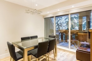 Dining area with view of BBQ deck.