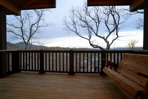 Open air deck with porch swing and long range mountain views.