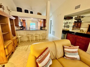 Living Area with View of Wet Bar, Wine/Beverage Frig and Counter Dining 