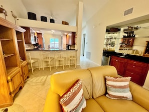 Living Area with View of Wet Bar, Wine/Beverage Frig and Counter Dining