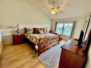 Master Bedroom, with King Bed, TV Sliders Leading to Lanai and View of Lake