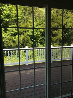 Walk out deck for added comfort in private yard to forest