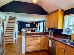 View of living and dining areas from kitchen.