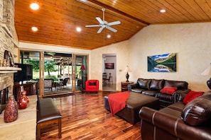 Living Room with walk out private patio and backyard 