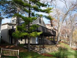 View from the lake- two large wrap around porches on Main and Lower levels