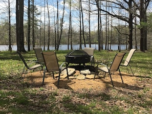 firepit over looks one of the 2 lakes on the 151 acre property