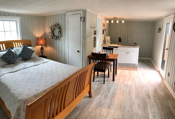 Comfy queen bed. Two chairs and a TV have been added. new pics soon.