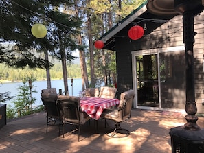 Outdoor dining on the deck overlooking the river. Propane heater and bbq.