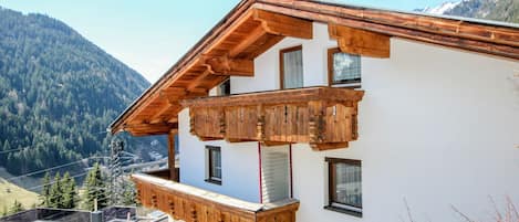 Sky, Property, Building, Window, Mountain, Plant, Wood, Slope, Tree, House