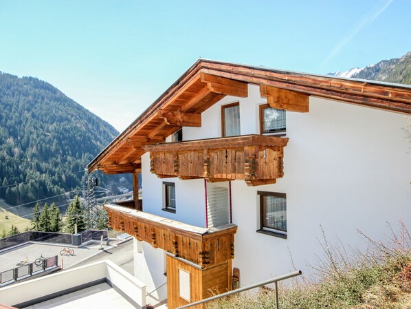 Sky, Property, Building, Window, Mountain, Plant, Wood, Slope, Tree, House