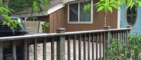Wooded cottage with attached deck