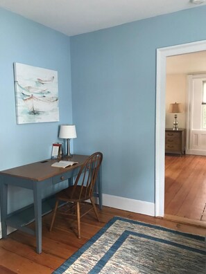 desk area in room with futon bed- this room connects living room to master
