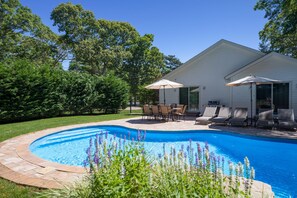 Private outdoor oasis with heated pool, hot tub, waterfall, and new Weber grill