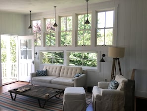 Living room entrance. 11' ceiling slopes down to 8'