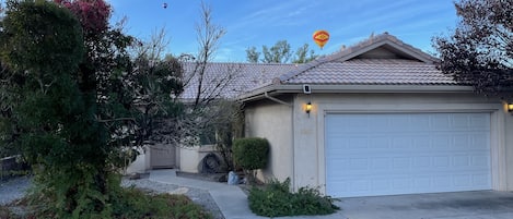 Beautiful New Mexico Zia Balloon over the house during Balloon Fiesta
