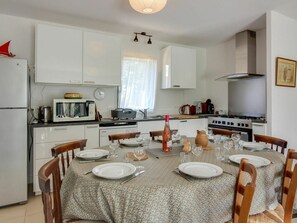 Table, Furniture, Property, White, Cabinetry, Chair, Countertop, Wood, Kitchen, Lighting