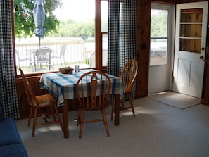 Table with great view of water, expands to seat 6.