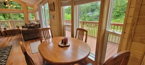 Dining area, with view of hot tub and deck!