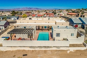 Rear drone image of the home. Mountain View. Amazing Pool view. You can play Pool, or sit and relax on the sun lounger in the Amazing view of the City.