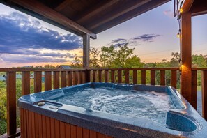 top level hot tub with a view of the mountains