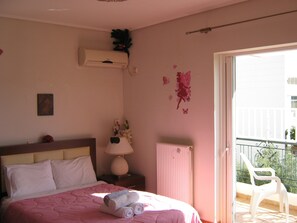 Our sunny master bedroom with queen bed bath and balcony