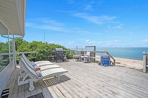 Deck with outdoor grill, and lounge chairs to enjoy the relaxing view