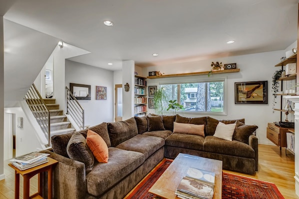 Cozy and new plush furniture and fireplace make this living room hard to leave!