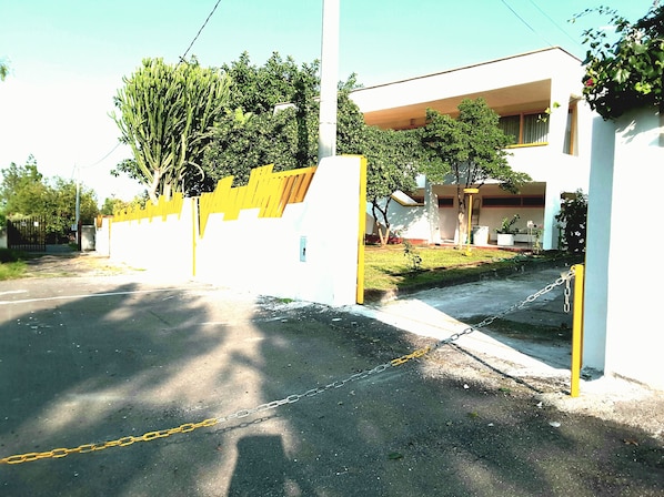 Main entrance and private road of  villa's California