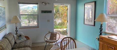 From the kitchen looking to the front door.  Notice the beam exposed ceiling. 