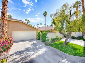 2 car garage and entrance to walkway to home is on the right.