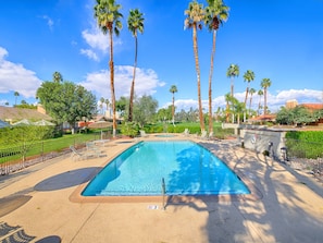 Heated pool and jacuzzi are located just steps away from your back patio