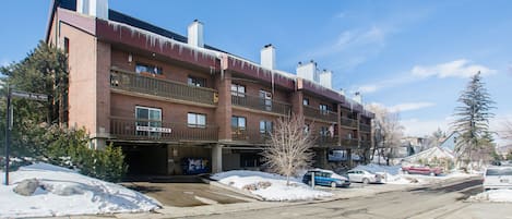 View of the building and the underground parking entrance.