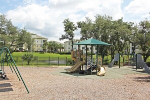 The view from our screened balcony. Children's Playground and lake and fountain 