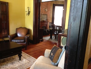 Spacious living room with wood burning stove.