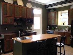 Large kitchen with many appliances and island.