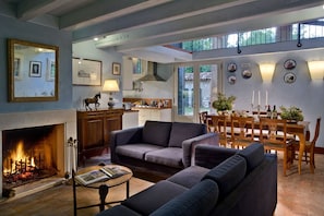 Spacious living and dining room with working fireplace