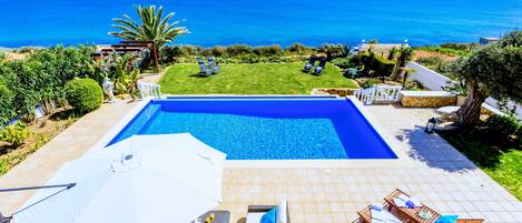 Terrace and pool area with unobstructed panoramic ocean view