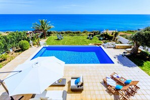 Terrace and pool area with unobstructed panoramic ocean view