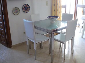 Dining area with doors to back terrace 