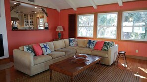 Living room with kitchen in the background