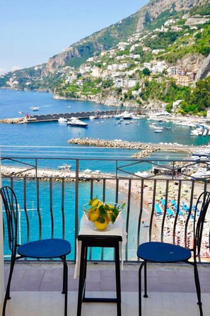 The balcony view of the port and the beach of Amalfi