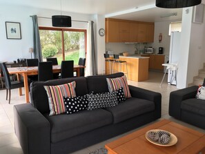 Open plan, stylish and spacious living room, dining area and kitchen.
