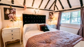 Stunning romantic beamed original Cottage bedroom.