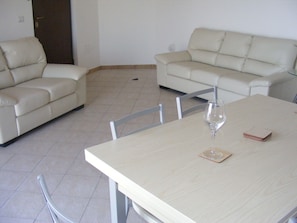 Spacious lounge & dining area leading to a large terrace
