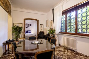 The Living & Dining Room, the sofa, the view of the First Bedroom