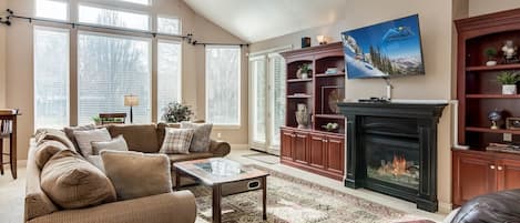 Gorgeous open great room with sectional sofa and fireplace