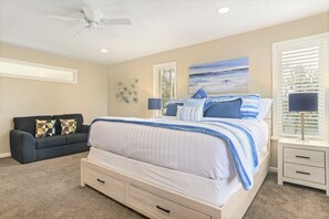 House 1 master bedroom with king bed and sofa